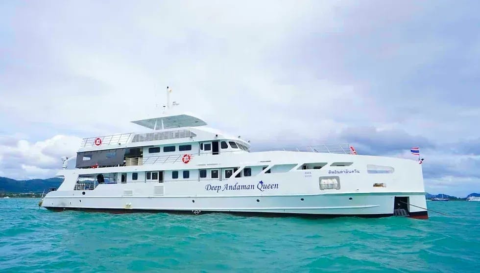Andaman Queen liveaboard at sunset with divers on deck